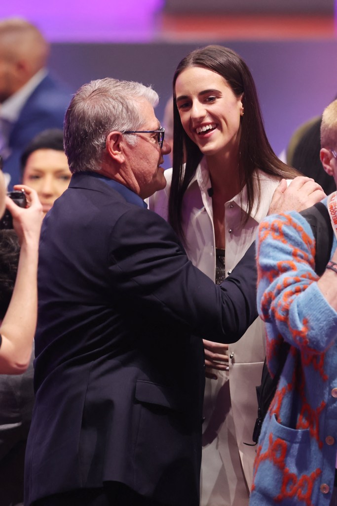 Caitlin Clark talks with Connecticut Huskies head coach Geno Auriemma before the 2024 WNBA Draft at Brooklyn Academy of Music. 