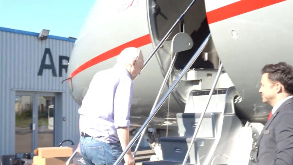 Assange boards a plane at a location given as London, Britain, on June 25, 2024.