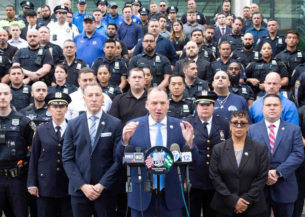 Police Benevolent Association President Patrick Hendry speaking to the media outside of the courthouse.