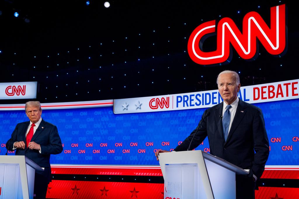 Former President Donald Trump and President Joe Biden at a podium during the CNN Presidential Debate in Atlanta, Georgia, 2024