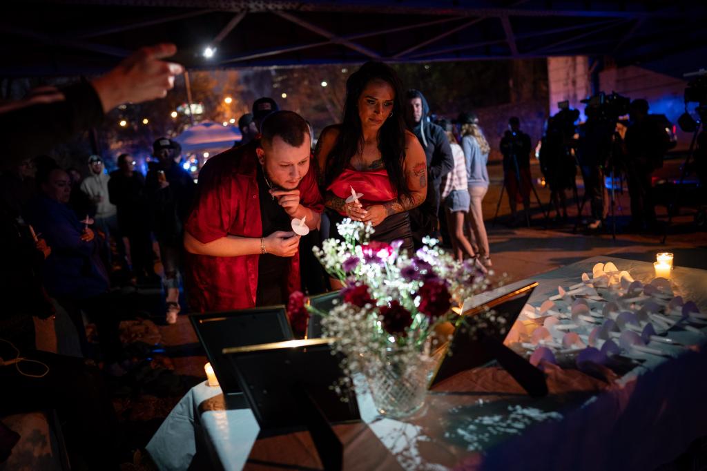 Mourners at a vigil for Strain near the Cumberland River on March 22, 2024.