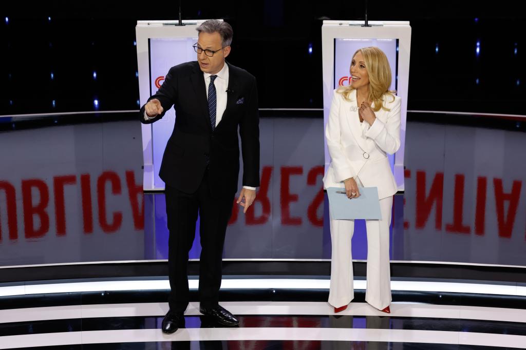 Moderators and CNN hosts Jake Tapper and Dana Bash speak to the audience before the start of the CNN Republican Presidential Primary Debate in Sheslow Auditorium at Drake University on January 10, 2024 in Des Moines, Iowa