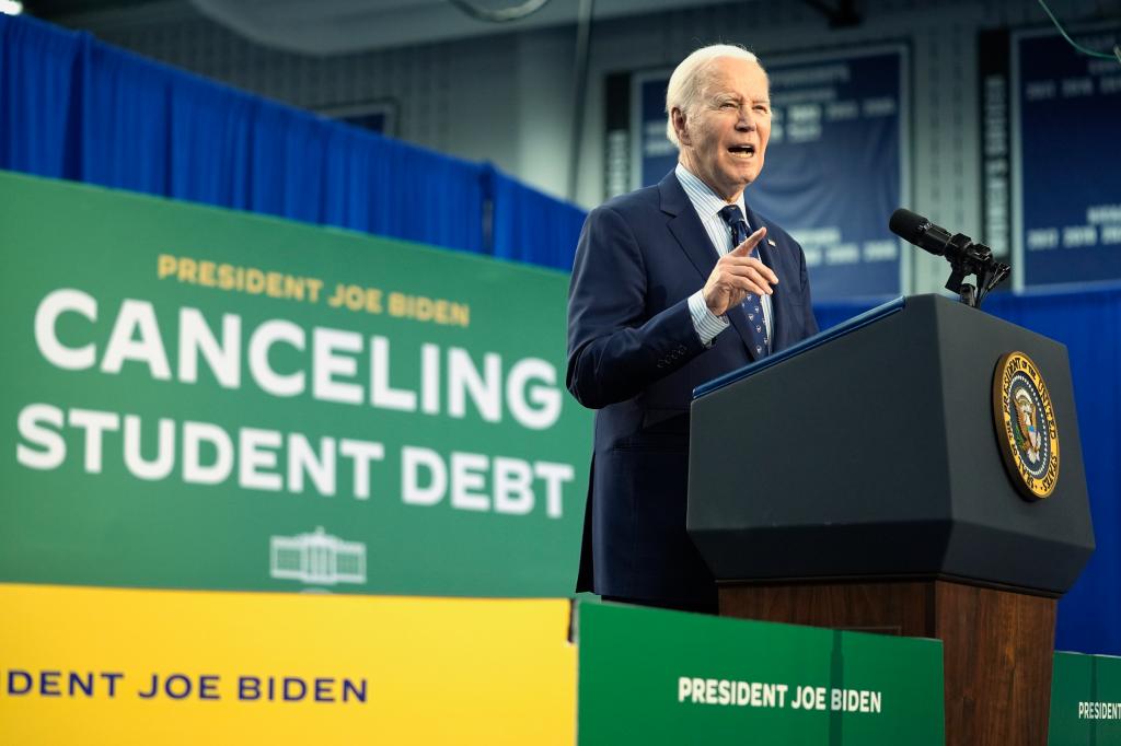 President Joe Biden speaking about student loan debt at a podium in Madison College, Wisconsin, April 2024