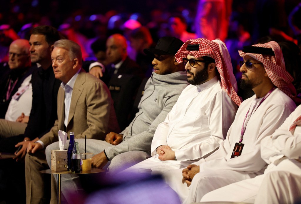 Boxer Anthony Joshua watching a match in Saudi Arabia.