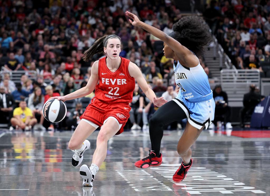 Caitlin Clark #22 of the Indiana Fever dribbles against Dana Evans #11 of the Chicago Sky during the first quarter in the game at Gainbridge Fieldhouse on June 01, 2024 in Indianapolis, Indiana.