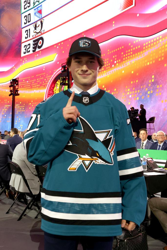 Macklin Celebrini holds up a finger signifying number one after being selected first overall by the San Jose Sharks during the first round of the 2024 Upper Deck NHL Draft at Sphere on June 28, 2024 in Las Vegas, Nevada.