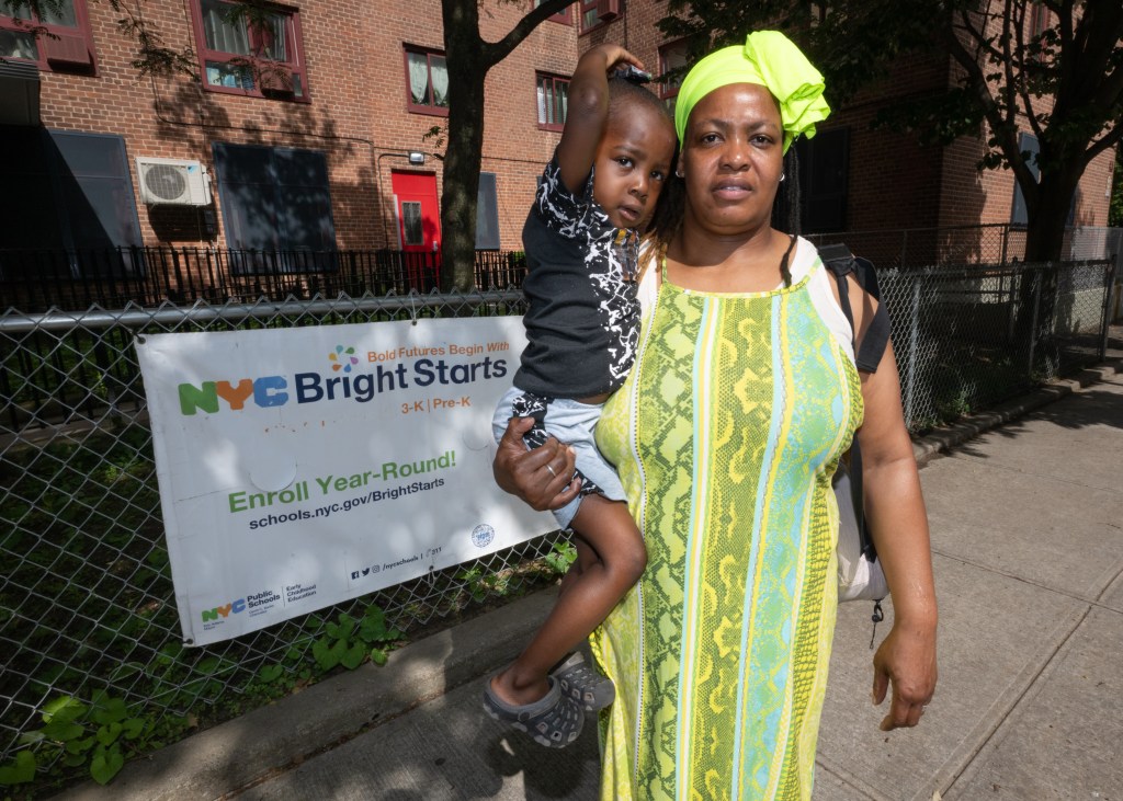 Wanda Shiver holding her son Dedjima-Yaw in Bronx, NY, expressing her thoughts on the protection of pre-K children