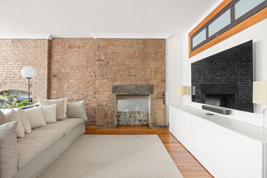 The edgy charm includes exposed brick.