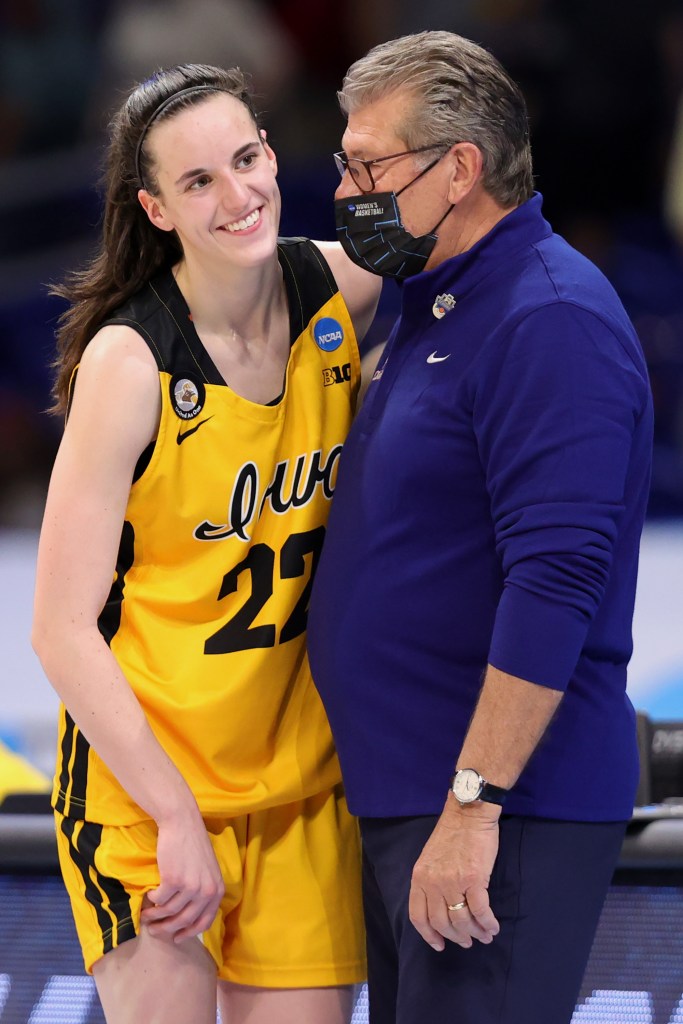 Geno Auriemma of the UConn Huskies speaks with Caitlin Clark #22 of the Iowa Hawkeyes following their 92-72 win in the Sweet Sixteen round of the NCAA Women's Basketball Tournament at the Alamodome on March 27, 2021.