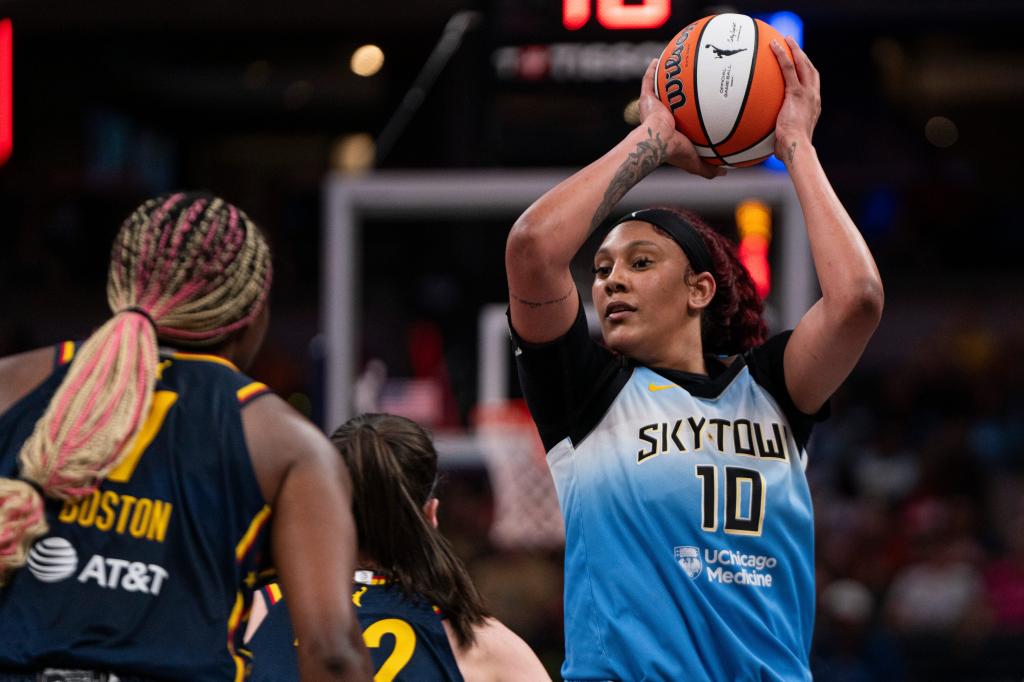 Chicago Sky center Kamilla Cardoso (10) holding a basketball, looking for an open teammate during a game at the Gainbridge Fieldhouse, Indianapolis.