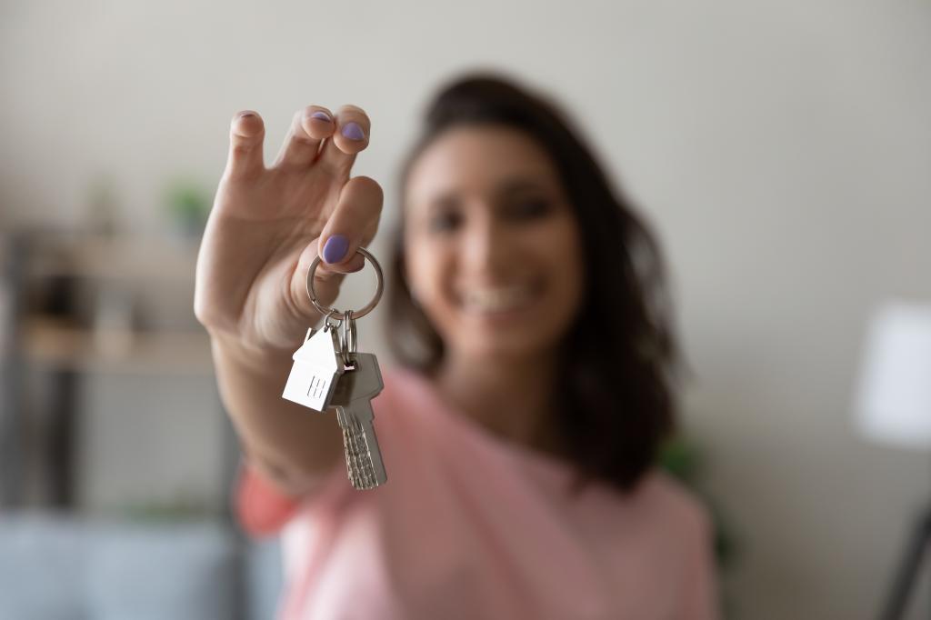 woman holding house keys