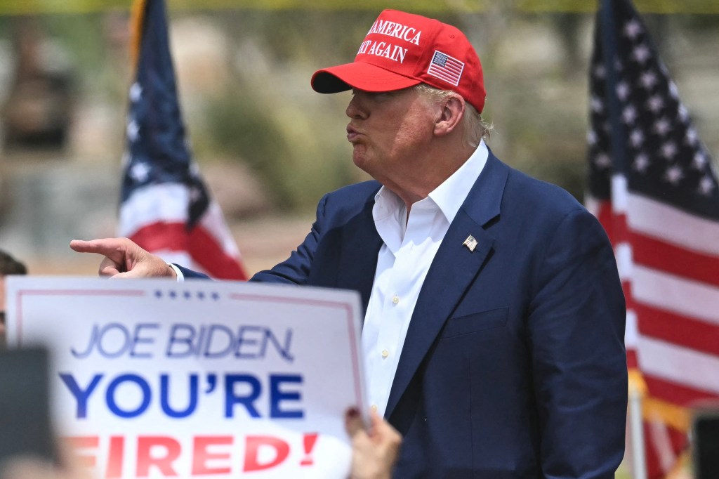 Donald Trump gestures to the crowd after speaking during a campaign rally at Sunset Park in Las Vegas, Nevada on June 9.