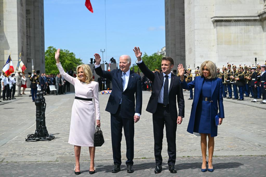 The Bidens and Macrons wave to the crowd during the welcoming ceremony for the state visit to France.