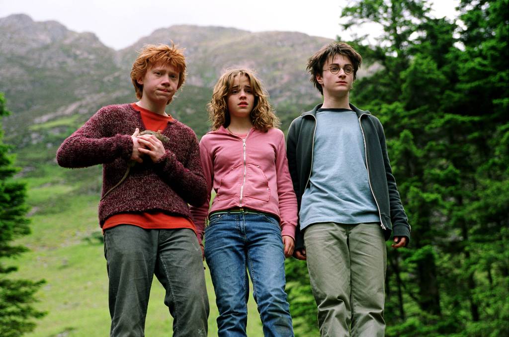 Rupert Grint, Emma Watson, and Daniel Radcliffe as Harry, Ron, and Hermione. 