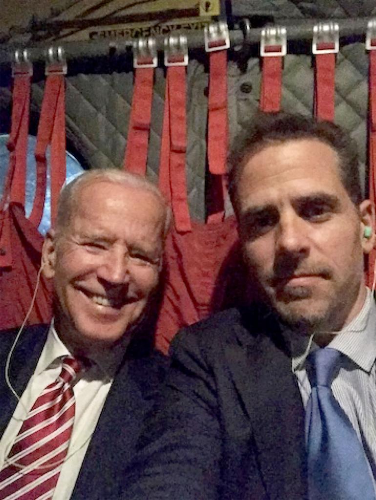 Hunter Biden and Joe Biden taking a selfie on a military aircraft