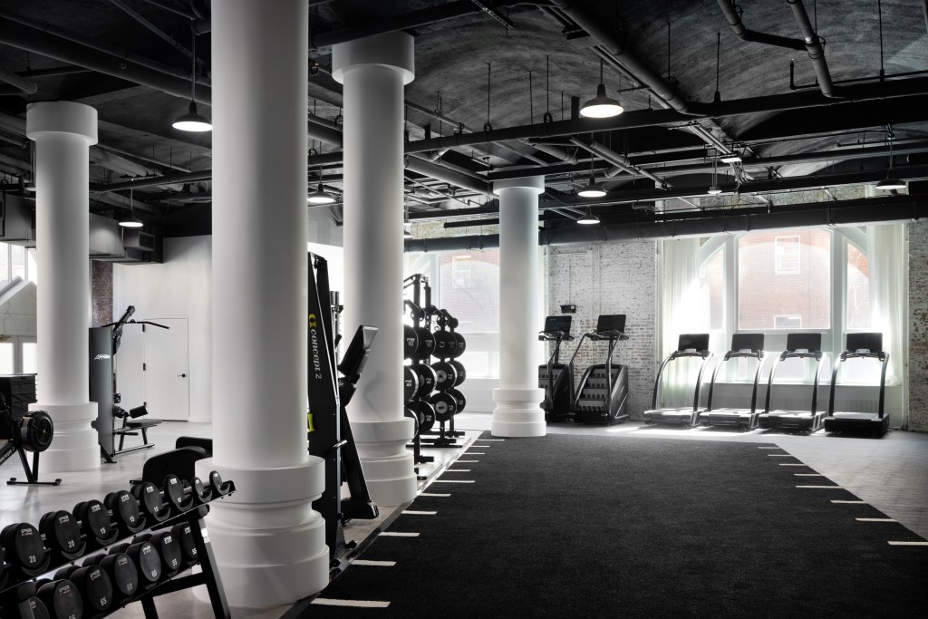 Interior view of the spacious two-floor Continuum Wellness Club located in Greenwich Village's historic Archive building.