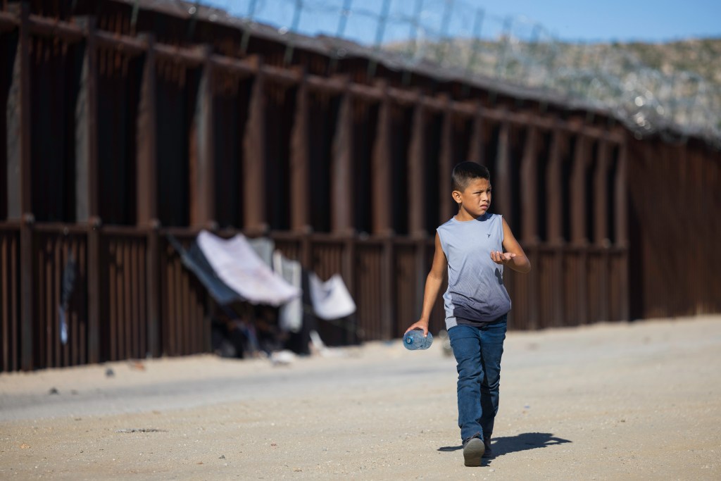 Migrants from around the world continue to arrive across the U.S. southern border near Jacumba Hot Springs, California. After crossing the border from Mexico migrants from countries including Sudan, Mauritania, India, China, Iran as well as many Latin American countries wait for Border Patrol to transport them for processing.