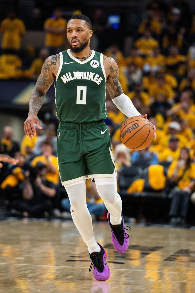 Milwaukee Bucks guard Damian Lillard (0) dribbles the ball during game three of the first round for the 2024 NBA playoffs against the Indiana Pacers at Gainbridge Fieldhouse on April 26, 2024.  