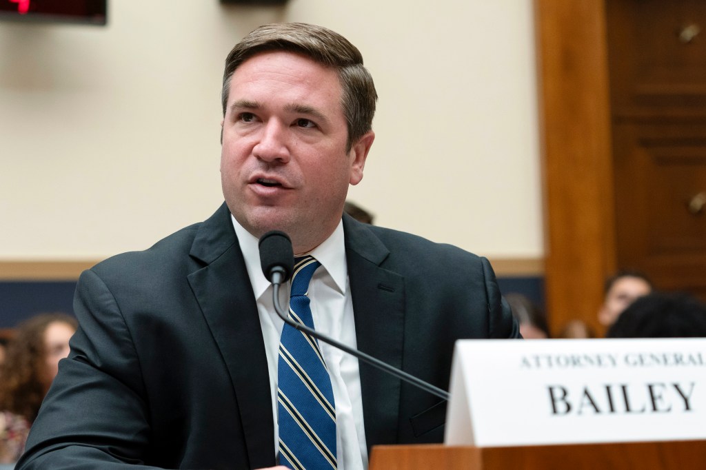 Missouri Attorney General Andrew Bailey testifying in a suit and tie at the House Judiciary Committee hearing on Capitol Hill.