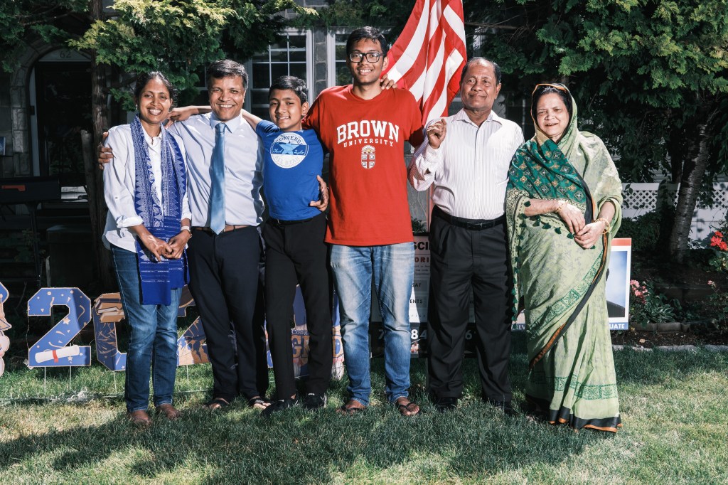 Family photograph featuring Suborno Isaac Bari, a 12-year-old prodigy bound for NYU, with his parents Shaheda and Rashidul, brother Refath, and grandparents Red and Sha.