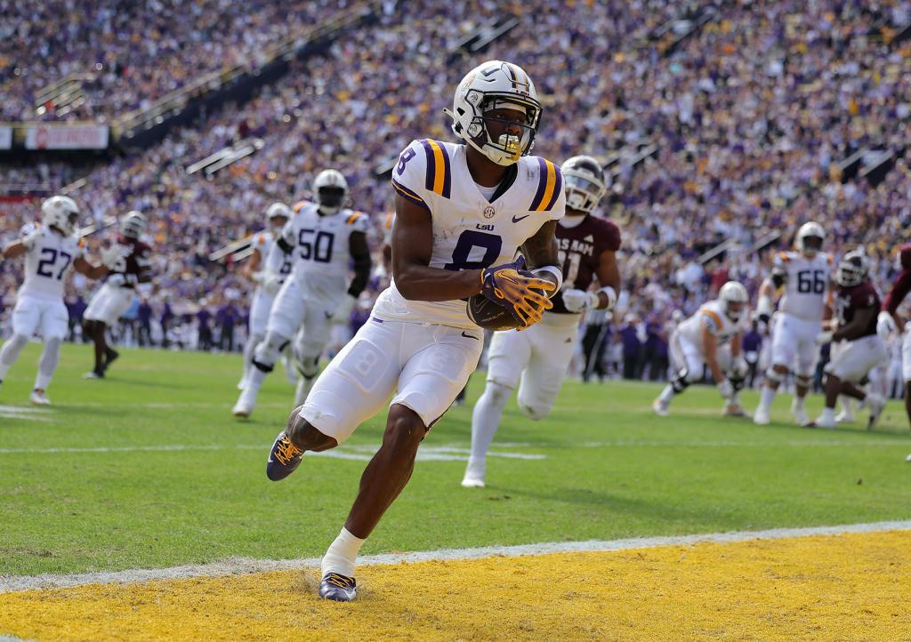 Malik Nabers #8 of the LSU Tigers scores a touchdown during the first half against the Texas A&M Aggies at Tiger Stadium on November 25, 2023 in Baton Rouge, Louisiana. 