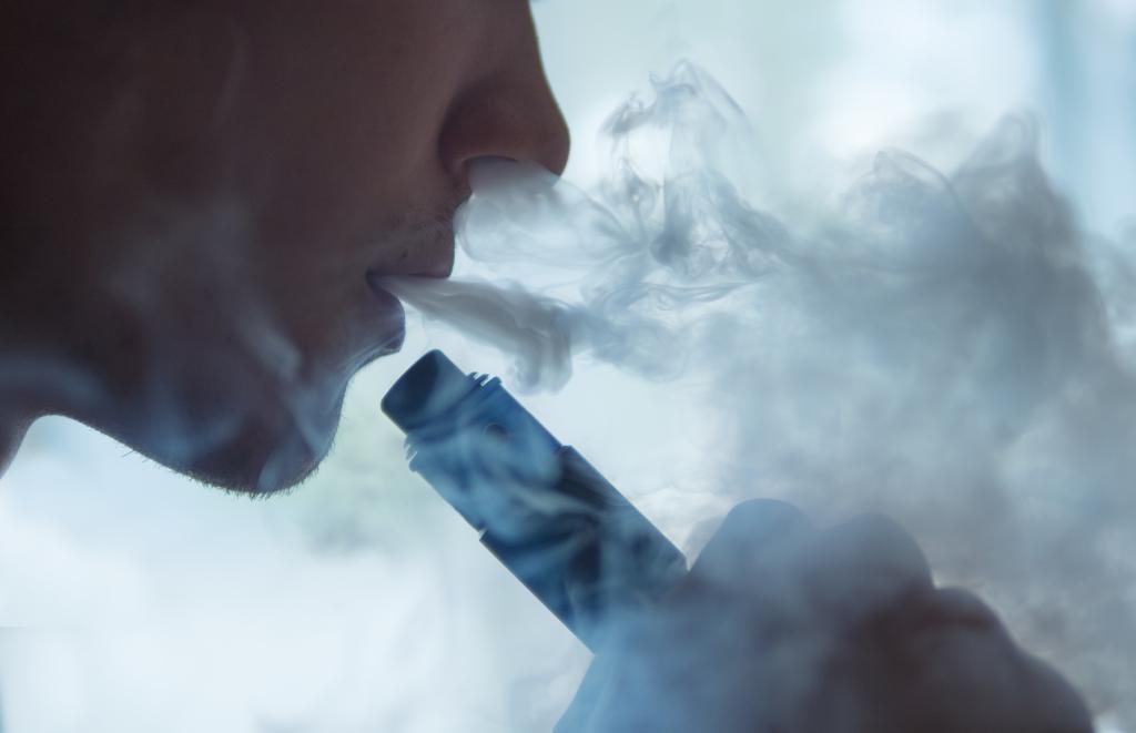 A teen vaping.