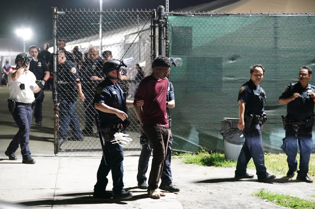 Bad blood boiled over between feuding groups of migrants at the Randall's Island shelter Friday night as a brawl broke out following an earlier stabbing, police and sources said.