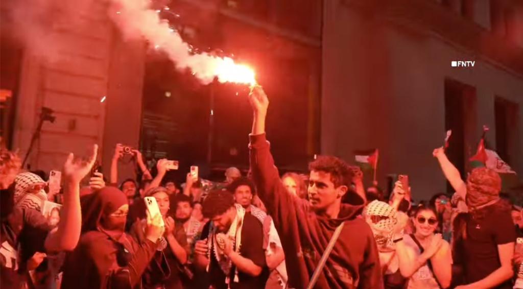 A protester holds a flare.