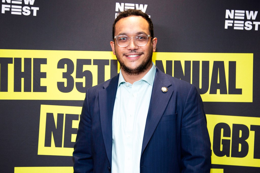 Shaun Abreu in a suit attending the premiere of 'Queen Of New York' at NewFest 35th Anniversary Festival in New York City