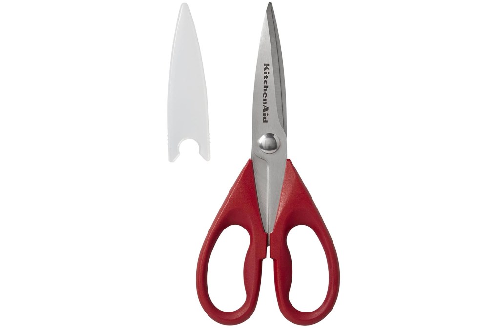 A pair of scissors with red handles.