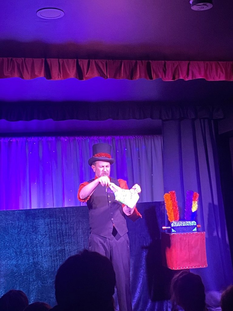 Morley the Magician performing a trick inside his theater in Butler.