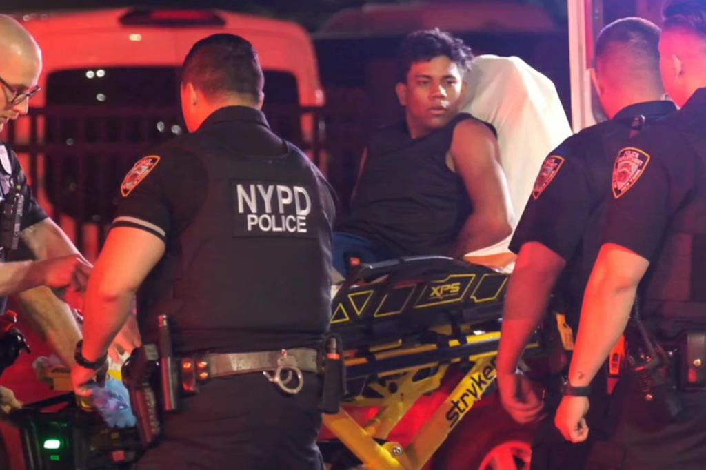 A defendant is seen on an ambulance stretcher.