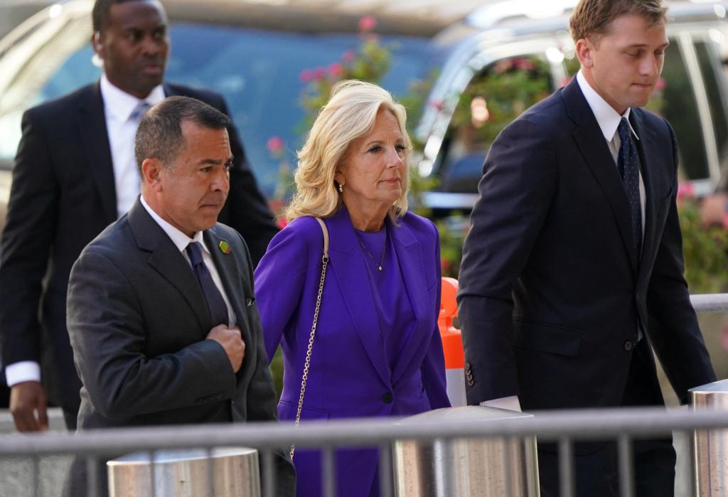 The first lady wore a purple suit and appeared relaxed ahead of the start of the trial.