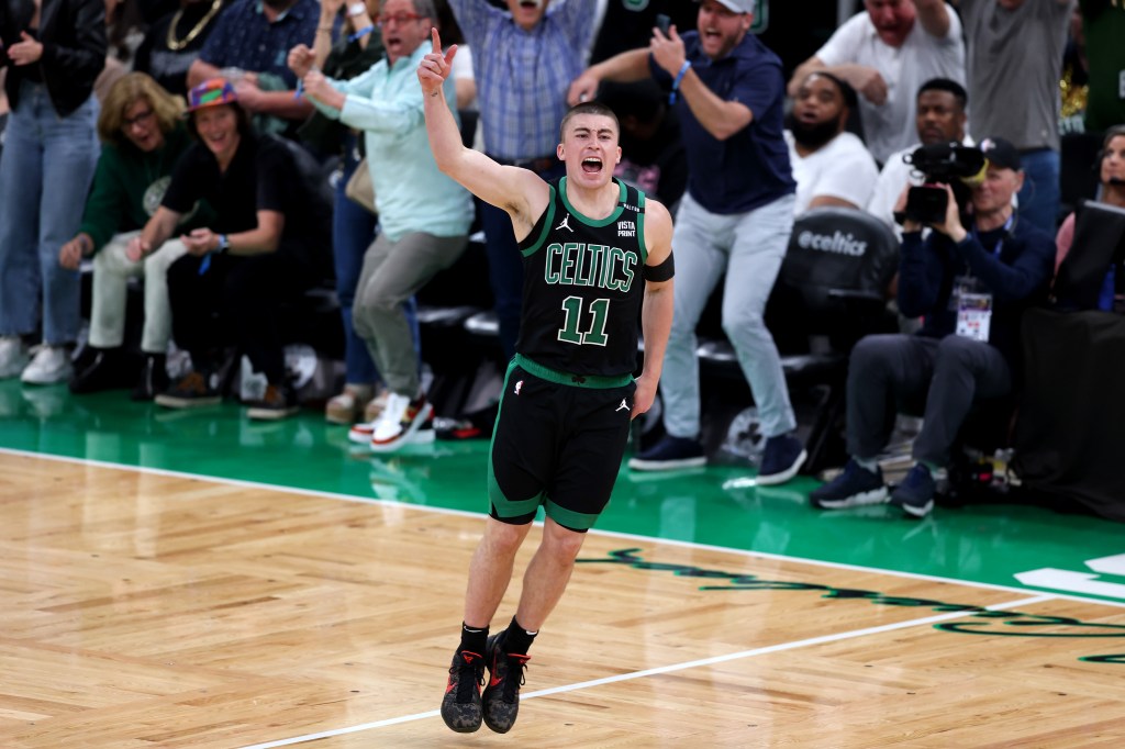 Payton Pritchard of the Boston Celtics reacting after making a three-point basket against the Dallas Mavericks in Game Two of the 2024 NBA Finals.