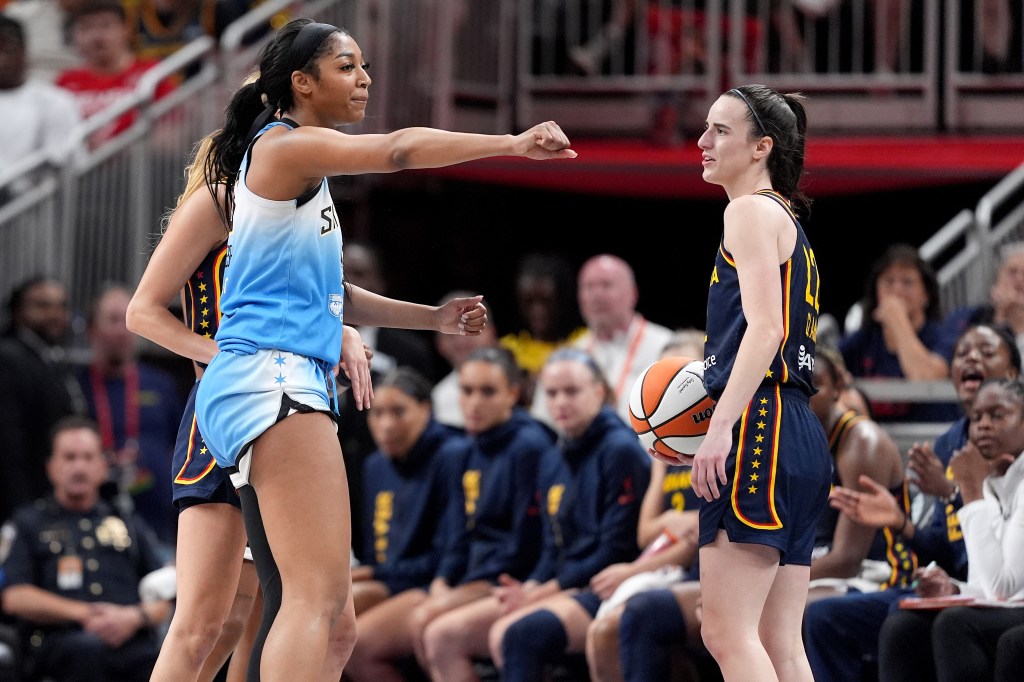 Angel Reese #5 of the Chicago Sky reacts after fouling Caitlin Clark #22 of the Indiana Fever during the second half at Gainbridge Fieldhouse.