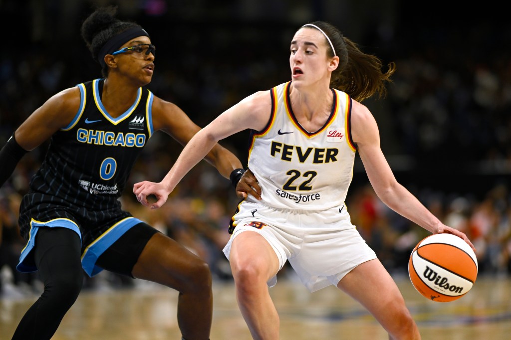 Caitlin Clark drives with the basketball in the second half against Diamond DeShields #0 of the Chicago Sky at Wintrust Arena on June 23, 2024.