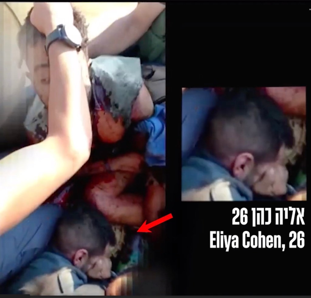 Eliya Cohen, laid relatively motionless with his face covered near Goldberg-Polin. 