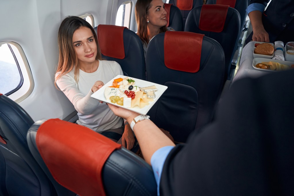 Female passenger receives food.