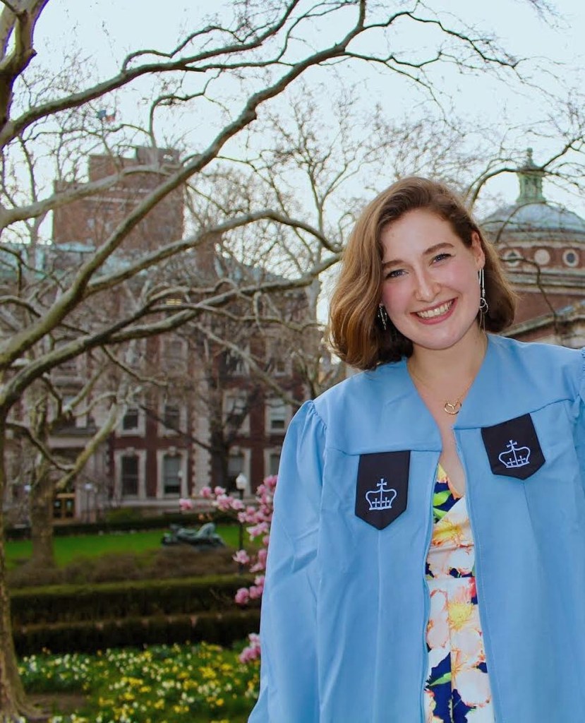 A woman smiling at the camera on her last day of being late to her classes at Columbia University