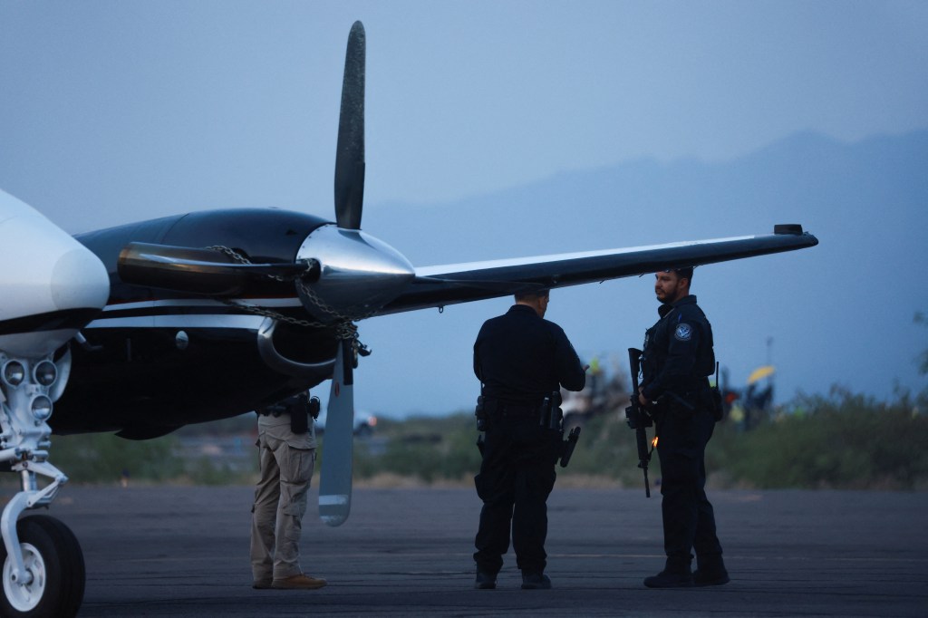 Arrest happening outside a private jet on the tarmac