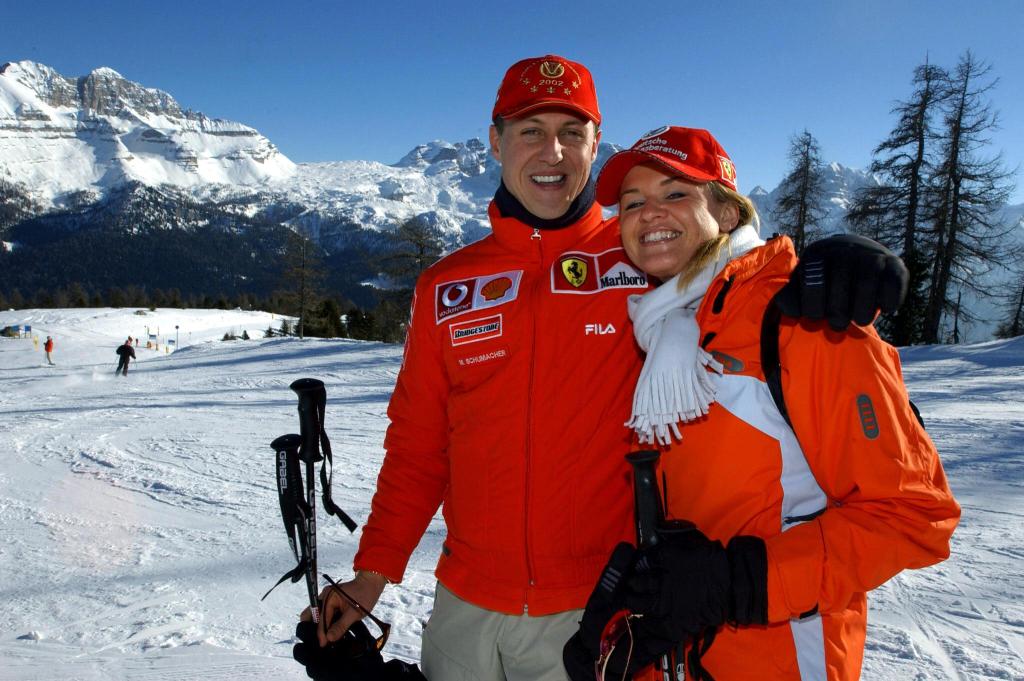 Formula one World champion Ferrrari driver Michael Schumacher (L) poses in Madonna di Campiglio with his wife Corinna on January 16, 2003.