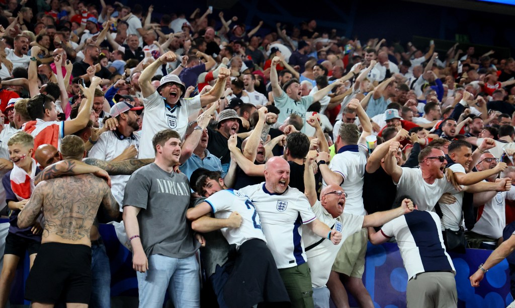 England fans celebrate Ollie Watkins' goal.