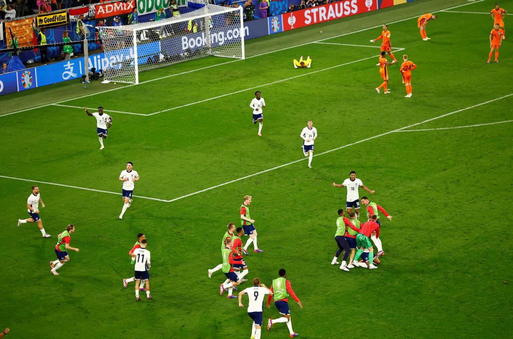 England's Ollie Watkins celebrates scoring their second goal with teammates.