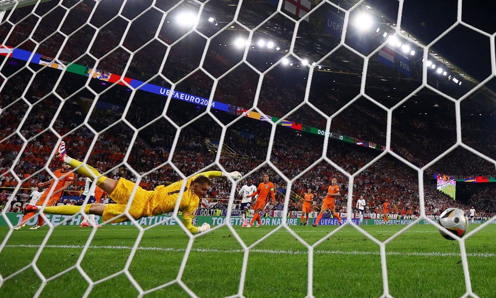 England's Ollie Watkins scores their second goal.