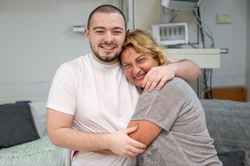 Andrey Kozlov embracing his mother, Evgeniia, after being rescued from Gaza in a joint operation by the Israel Defense Forces, ISA, and Israeli Police