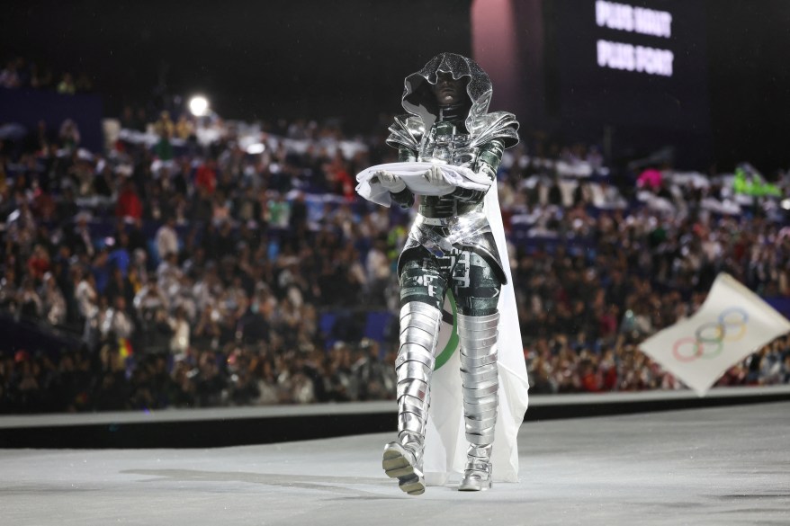 The Olympic Flag is presented by the The Horsewoman at Place du Trocadero during the opening ceremony.