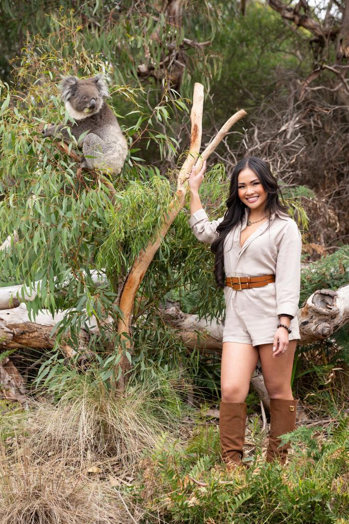 Jenn Tran posing with a koala in Australia.