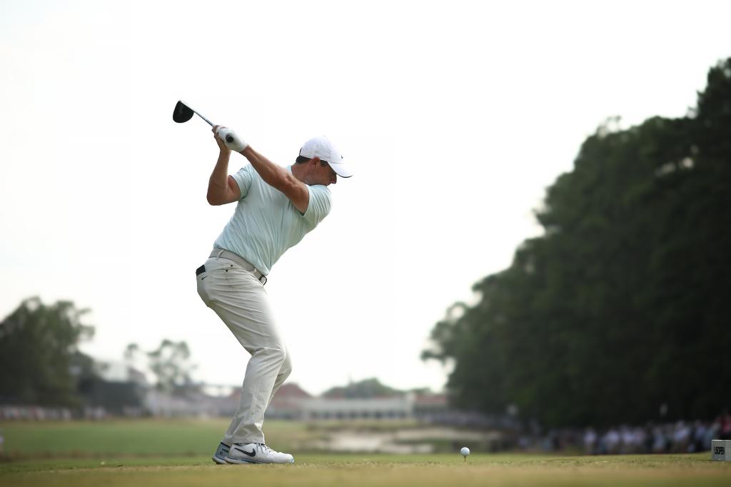 Rory McIlroy of Northern Ireland swinging a golf club for a tee shot on the 18th hole during the final round of the 124th U.S. Open at Pinehurst Resort, North Carolina.