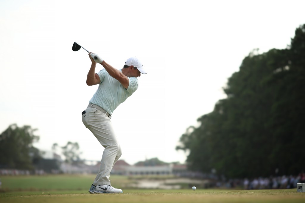 Rory McIlroy of Northern Ireland swinging a golf club for a tee shot on the 18th hole during the final round of the 124th U.S. Open at Pinehurst Resort, North Carolina.