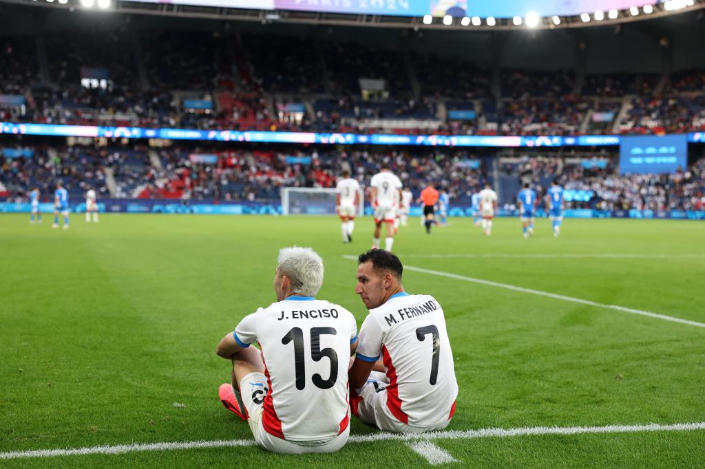 Julio Enciso #15 and Marcelo Fernandez #7 of Team Paraguay celebrate after winning the Men's group D match between Israel and Paraguay during the Olympic Games Paris 2024 at Parc des Princes on July 27, 2024 in Paris, France.